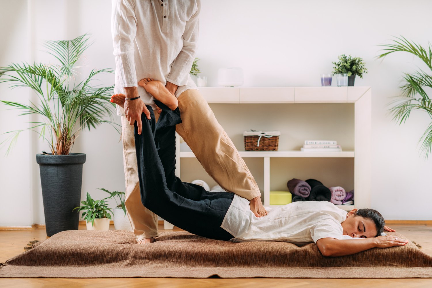 Therapist Massaging Womans Back. Woman Getting Shiatsu Back Massage.